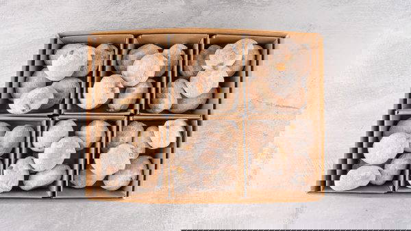 Selection of mini doughnut tray filled and ready for next day office catering delivery