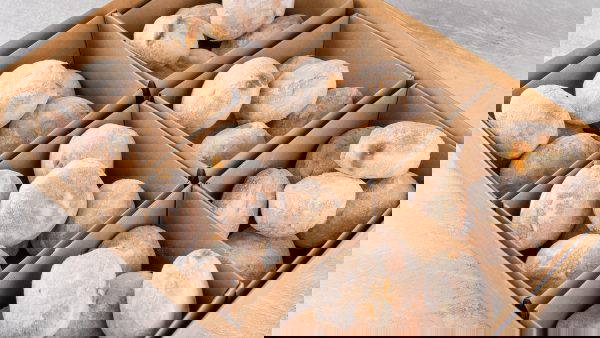 Selection of mini doughnut tray filled and ready for next day office catering delivery