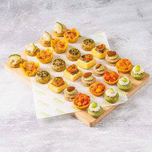 Large assortment of finger canapes for corporate lunch delivery